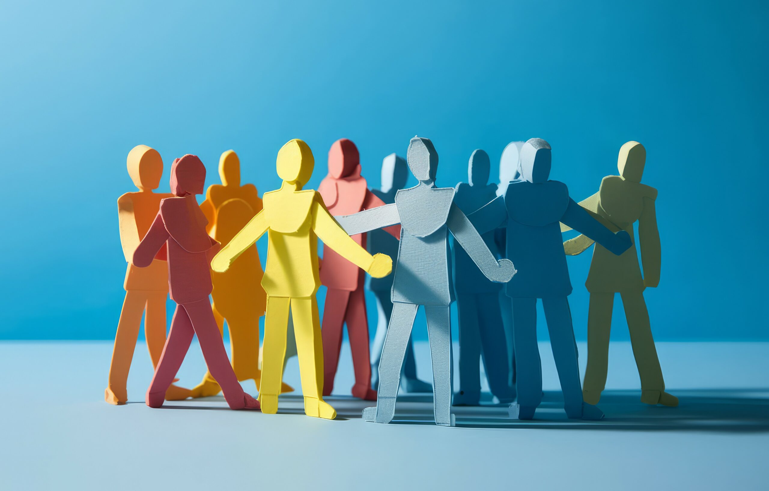 A group of paper people coming together. Community and friendship concept